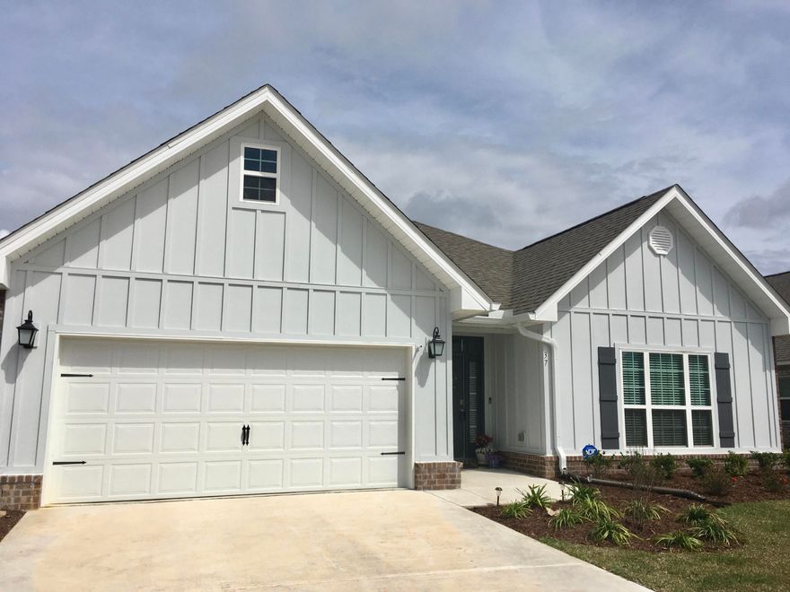 Barely lived in home in Hammock Bay's Central Park neighborhood. This beautiful home is a must see, no builder grade here, the current owners have added, ceiling fans in all bedrooms, blinds throughout, custom lighting, new landscaping, gutters over the front entry, gas stove and refrigerator. The oversized foyer leads to the open living, kitchen and dining room. The living room has a double treyed ceiling with crown molding, and the kitchen boast white cabinets with granite countertops. The back porch has a gas stub for a grill and the backyard is spacious as well. The master suite has a garden tub and a tiled master shower as well as granite countertops. Don't miss out on this home, Central Park is nearly built out with no more of this floor plan (the Boneventure).