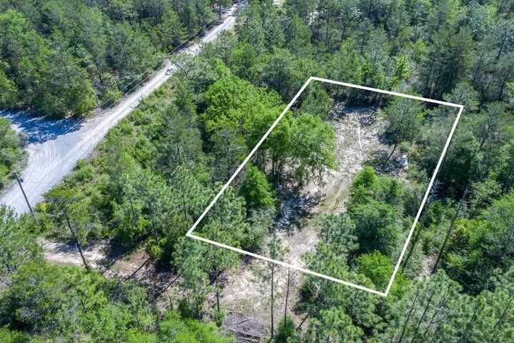 This would make the perfect building lot or lot for your manufactured home. The lot is fenced and has a power pole.