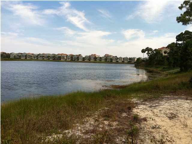 Beautiful lake front lot in the gated subdivision of Destiny. Just a short walk to the white beaches and emerald green waters of the Gulf. Enjoy the pavilions and restaurants just right across the street. Destiny amenities include an Olympic size pool, tennis court and fitness room. There is not a build out time frame. a perfect opportunity to build your dream home