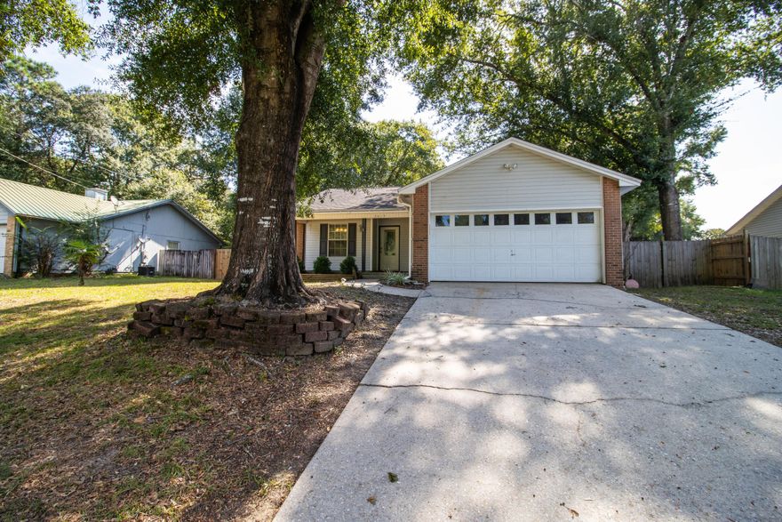 VA assumable loan for VA eligible buyer, call for details. Welcome to a lovely home located in Crestview south of I-10. Grab a rocking chair to enjoy the front porch, or enjoy the endless possibilities the fence backyard has to offer.  This lovely three bedroom two bath home has LVP and Tile flooring, and the majority of the interior is freshly painted. The living room features both vaulted ceilings and a fireplace. The sunroom provides additional space for entertainment. Step outside to the spacious backyard that has a shed with electric, and conveys asis. Between the garage and the shed this home provides an abundance of storage options. Enjoy the benefits of paid off Solar Panels. Freshly power washed and ready to be viewed. The HVAC is 2023, roof 2011, and the water heater 1991.