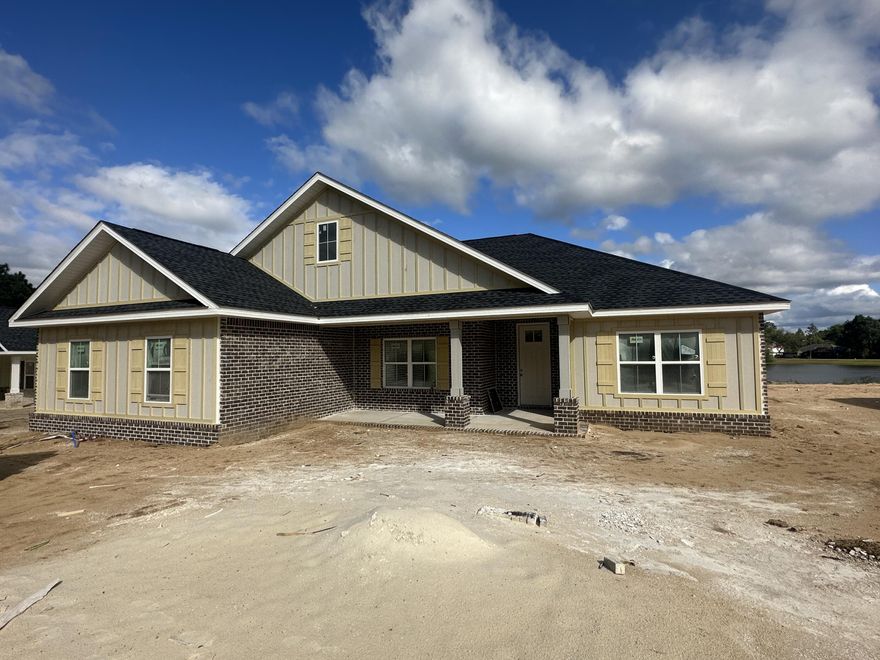 Huge Lake front homesite. NEW Home currently under construction!  This home will be complete with exterior brick and hardy accents. The home has 4 bedrooms 2 baths. Open floor plan for family and friend get togethers.  Beautiful lake view from the picture window in the breakfast area. Side entry garage. Located at the South end of Crestview with new growth and just a short drive to beaches, bases, local schools, hospital, south Publix, restaurants, and Crestview Commons, Hwy 85 and I-10 are in close proximity to the property. Photos are sample of similar build.