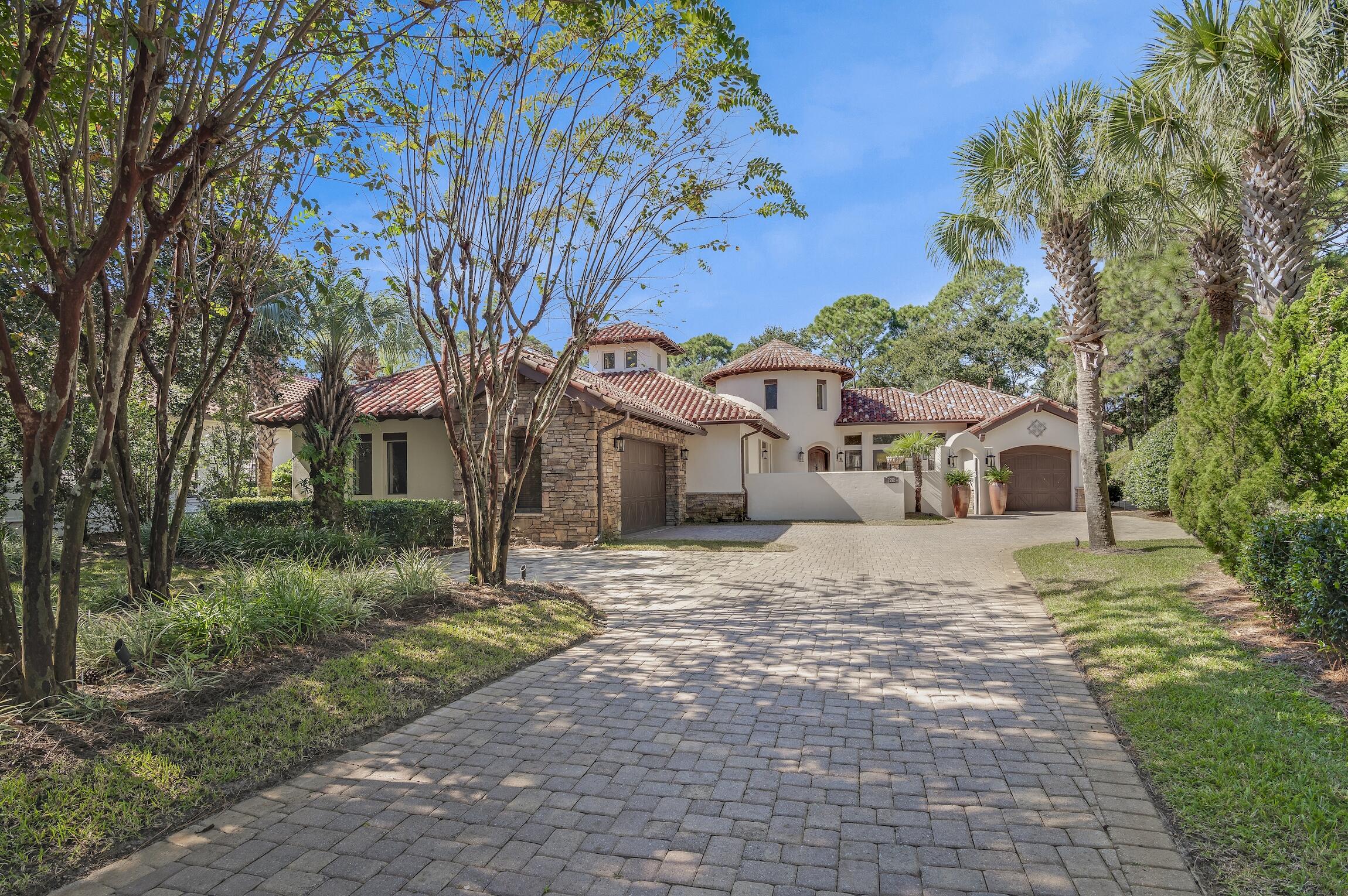 This exquisite custom-built, sprawling, single story home is truly one of a kind. Tucked away on a prime, estate sized lot and cul-de-sac, located in the gated neighborhood of Burnt Pine and on the 2nd tee box of the Burnt Pine Golf Course, is a Tuscan inspired treasure. At 3,949 sq. ft., 3 beds, 5 baths, plus office, built by Sweet Homes as the builder's residence, the finishes are beautifully extraordinary. The many authentic wooden beams and wood planked ceilings are a timeless feature and from the illuminated brick covered barrel hallway ceiling to the stone accent walls, it is a showplace of craftsmanship and architectural design. Enter by an arched courtyard gate that leads to a tranquil, cascading fountain. The grand foyer, with its impressive twenty foot turret wooden ceiling