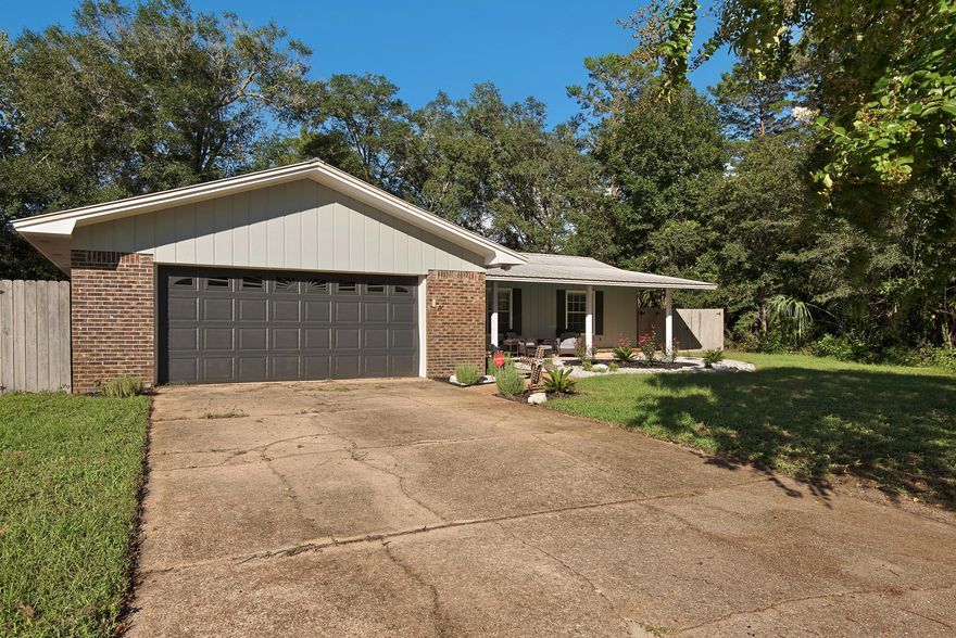 Motivated Seller, One of a kind, fully renovated lake front home with open floor plan! Beautiful bamboo floors throughout! Stunning custom kitchen includes: granite counter tops, new stainless steel appliances and farmhouse sink, double wall oven, induction cook top, and built-in beverage center; New geo-thermal water heater and electrical panel; Modern, tiled floor to ceiling wood burning fireplace; Wired for wall mount TVs and 7.1 surround sound; Walk-in master closet and double vanity in renovated master bathroom; Florida room which leads to large, fenced-in backyard with private dock on lake; Metal roof. Furnished optional,