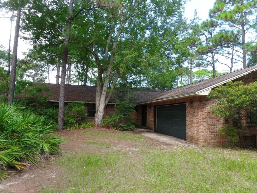 REO - Wow! This is the waterfront living opportunity that you have been waiting for! This great home sits back off the road on a huge secluded 1.69 acre lot on the canal. Spacious 3/2.5 brick home with a 2 car garage, screened in porch, fireplace and loads of potential. Come see this great property today before it's gone!