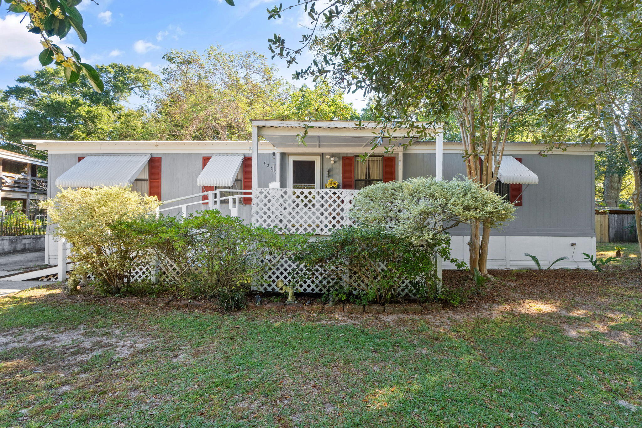 Escape to waterfront living at 4200 Trout Ave in Milton! This charming manufactured home sits on a peaceful canal with a private dock and fully operational boat lift, offering easy access to the bay for boating adventures. Cast a line right from your backyard and enjoy some of the best fishing the area has to offer. With plenty of outdoor space to relax or entertain, this property is perfect for weekend getaways or full-time coastal living -- all at an incredible value!