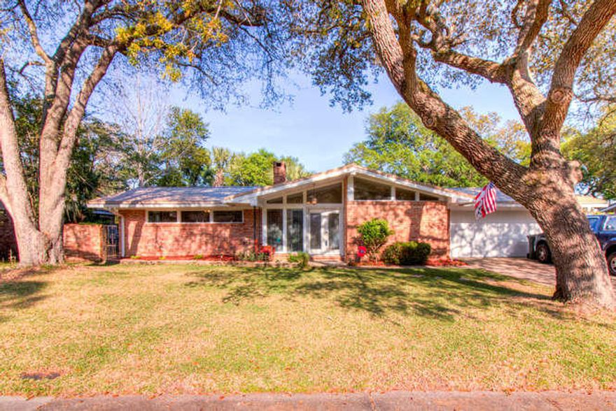 Amazing Saltwater Pool WITH a sweet house located in the heart of the Kenwood Subdivision. 3 bedrooms, 2 bathrooms (one retro and one remodeled), beautiful updated kitchen located right off the amazing pool deck, with a two-car garage. The metal roof installed in 2016, hard surface floors (hardwood and tile) throughout, most of the windows and doors have been replaced including the garage door. The home features two living room areas to stretch out in. One even has an amazing little patio, perfect for a firepit and smores roasting...and have we mentioned the pool?