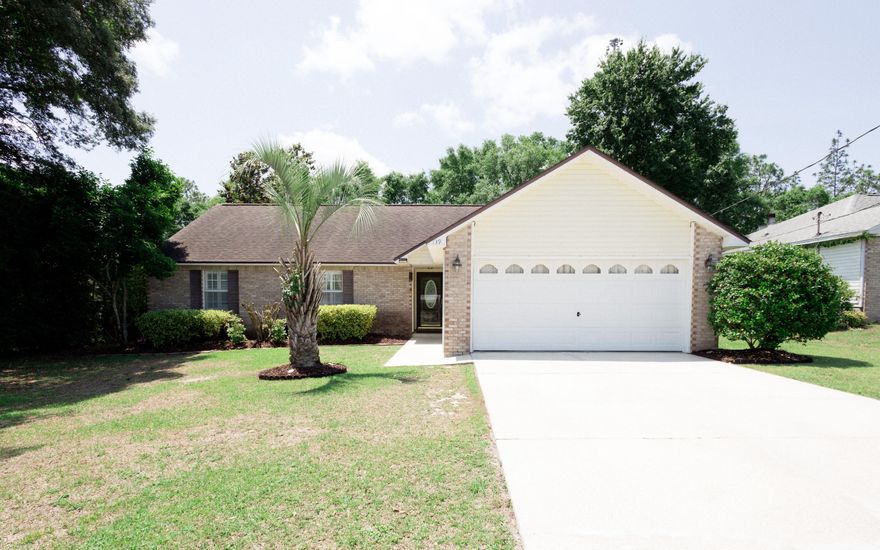 Welcome to this meticulously maintained, one owner, 3 bedroom, 2 bathroom, pool home. Centrally located in Crestview -  less than a mile away from I-10 for quick commuting, and just minutes away from shopping, dining, and grocery stores! Excellent location to local military bases - just 13 minutes away from Duke Field Afs and 25 minutes to Eglin Afb. Nestled in the Park Place subdivision - enjoy the freedom of no HOA. Inside, you'll find hardwood and tiled flooring, an updated chef's kitchen - complete with granite countertops, upgraded backsplash, BEAUTIFUL cabinetry, and stainless steel appliances -  as well as a breakfast bar, and a breakfast nook. The main living area features a wood-burning fireplace and a cathedral ceiling to open up the space. The primary bedroom boasts an oversized walk-in closet and a spa-like ensuite with updated tiled shower and floor, double vanity, and water closet. The 2 car garage has been finished out into additional living space with tiled flooring, but could easily be converted back to utilize as a garage. Step out onto the patio to discover your very own oasis! With an enclosed extra large pool and hot tub spillover system and covered patio - it's the perfect spot for outdoor entertaining while the screened enclosure keeps the bugs away! Enjoy peace of mind with a brand new roof with transferable 15 year warranty! Schedule your showing today and check it out!
