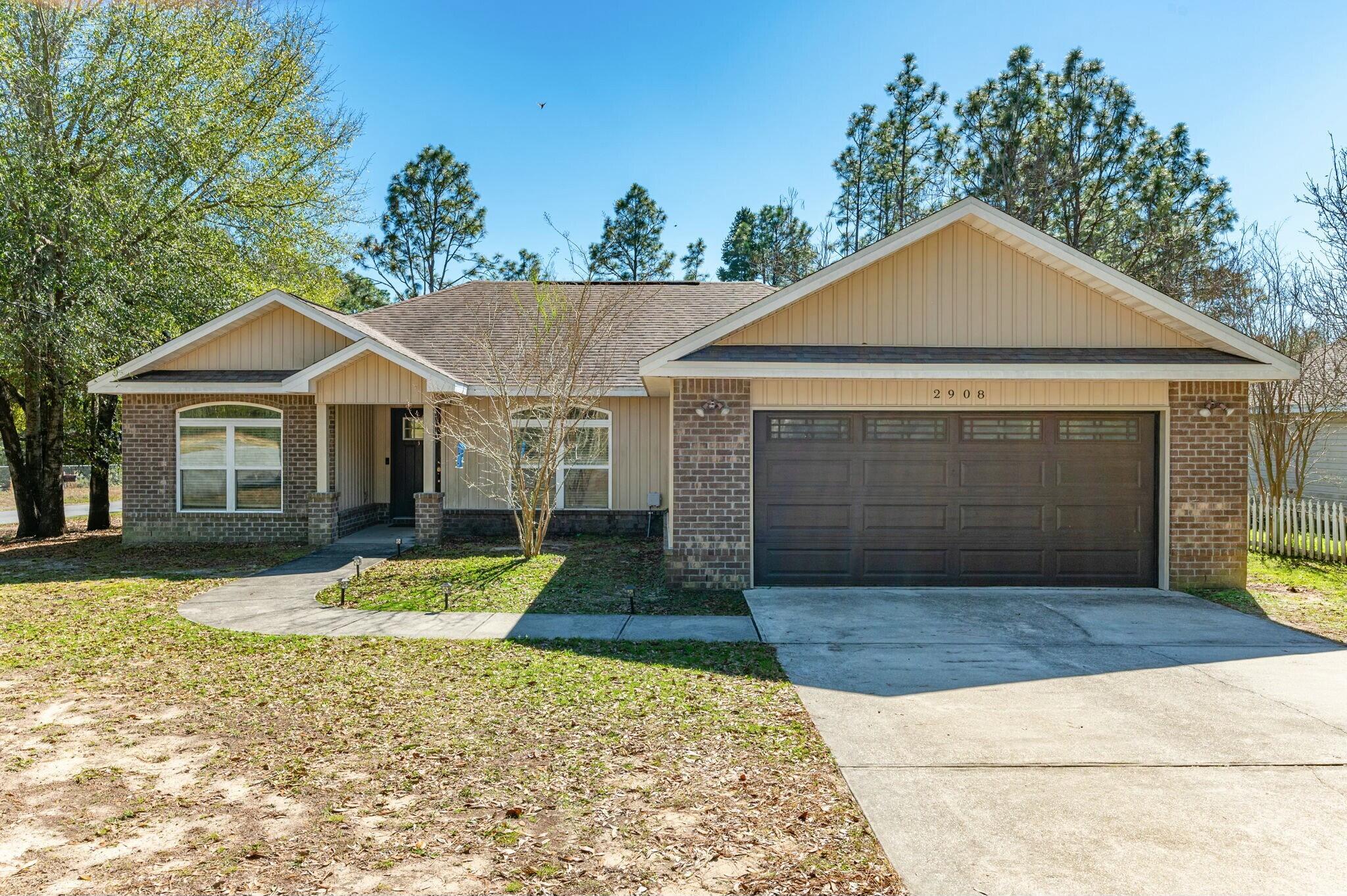 Welcome to your dream home in Crestview, FL! Situated on a spacious corner lot, this stunning 4-bedroom, 2-bathroom home offers comfort, style, and functionality. The living room's tall vaulted ceilings create an open, airy feel, while large windows bring in natural light. The kitchen boasts ample cabinetry, sleek countertops, modern appliances, and an island flowing into a cozy dining area. The split floor plan ensures privacy. The luxurious primary suite features trey ceilings, a spa-like en-suite with a soaker tub, a separate shower, dual vanities, and a large walk-in closet. Three additional bedrooms provide flexibility for guests, an office, or hobbies. Step outside to a private backyard oasis. It is fully fenced for pets and outdoor fun and has space for a garden, playset, or pool. Additional features include a laundry room and a two-car garage. The HVAC was replaced in 2020. This home is a must-see. Schedule your private showing today! (Water Softener System to convey AS-IS)