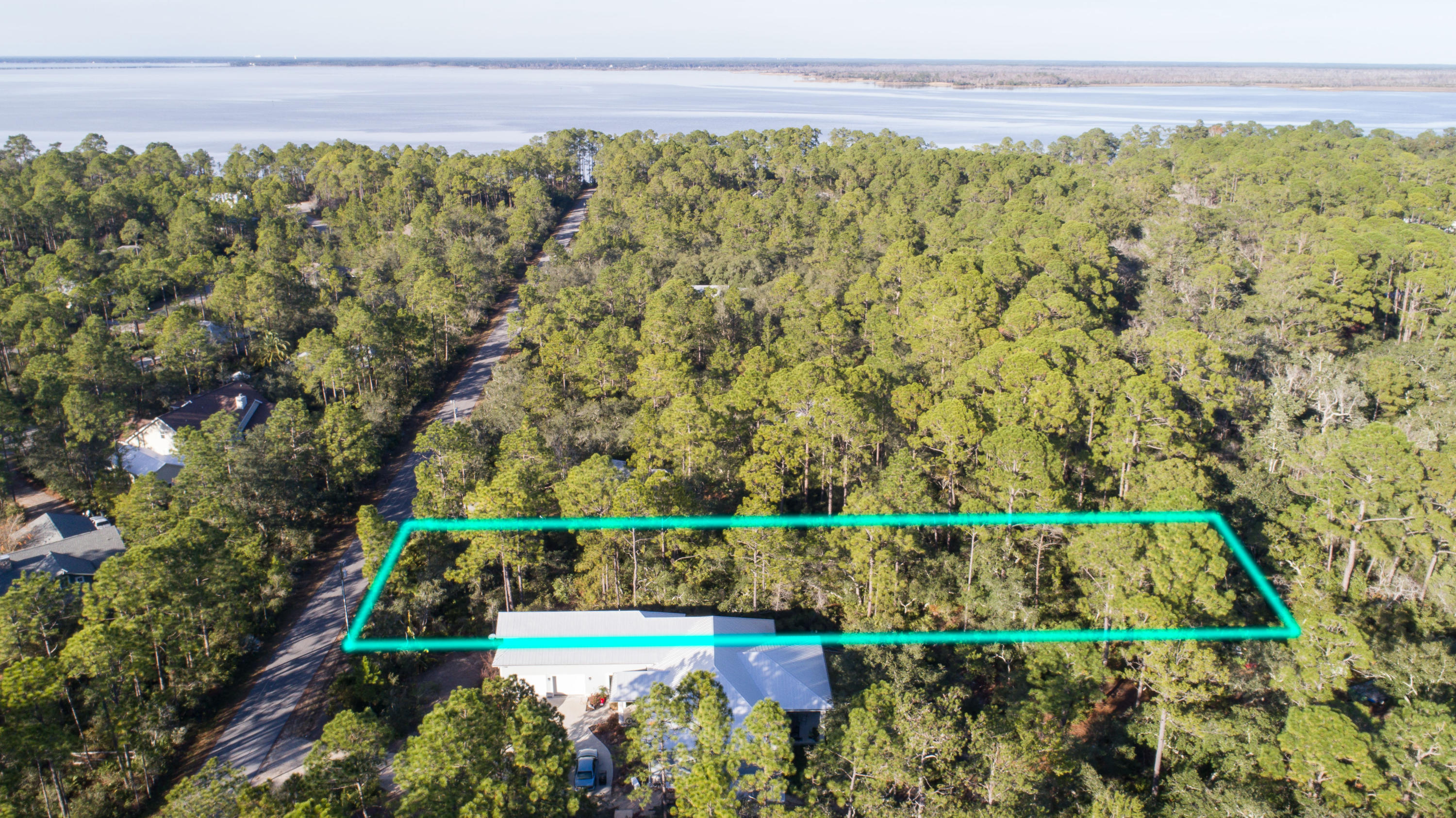Large, wooded lot in Point Washington with lots of privacy. This huge lot is just minutes to the beach and all the best dining, unique boutique shopping, art galleries, art festivals, outdoor concerts, bike paths & some of the most challenging golf courses the gulf coast has to offer. Easy access to Hwy 98, allowing you to explore the nearby cities of Destin or Panama City Beach, as well as the Northwest Florida Beaches International Airport.