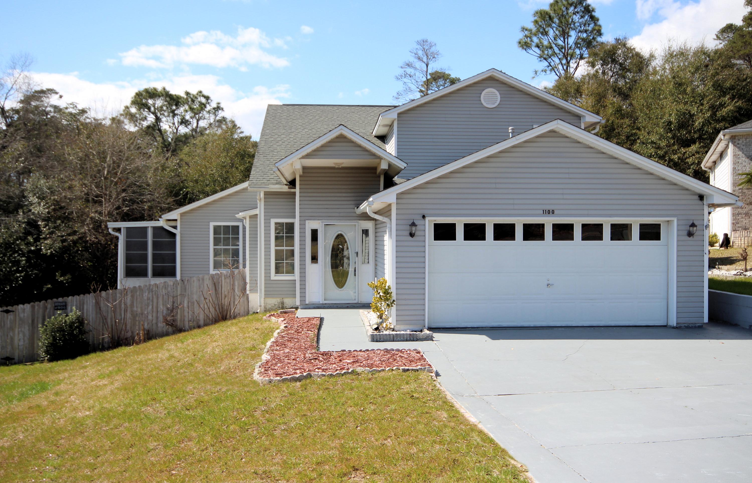 Large, beautiful home in the heart of Niceville! This well-maintained home with TWO sunrooms is a must see for anyone looking for quality, Florida living. Living room offers open view of upstairs, natural skylight, gas fireplace with decorative accents and mantle. Formal Dining area with adjacent sunroom off of living room. Master suite with private sunroom on ground floor. Master bath is complimented with double vanities. Kitchen adjacent to living Room and with breakfast bar, ample counter space, breakfast table area and decorative backsplash. Additional bedrooms upstairs with shared bathroom and media Room. Large covered deck that provides lots of storage space. Freshly painted inside throughout. Square footage taken from PA website. Buyer to verify all measurements & size.