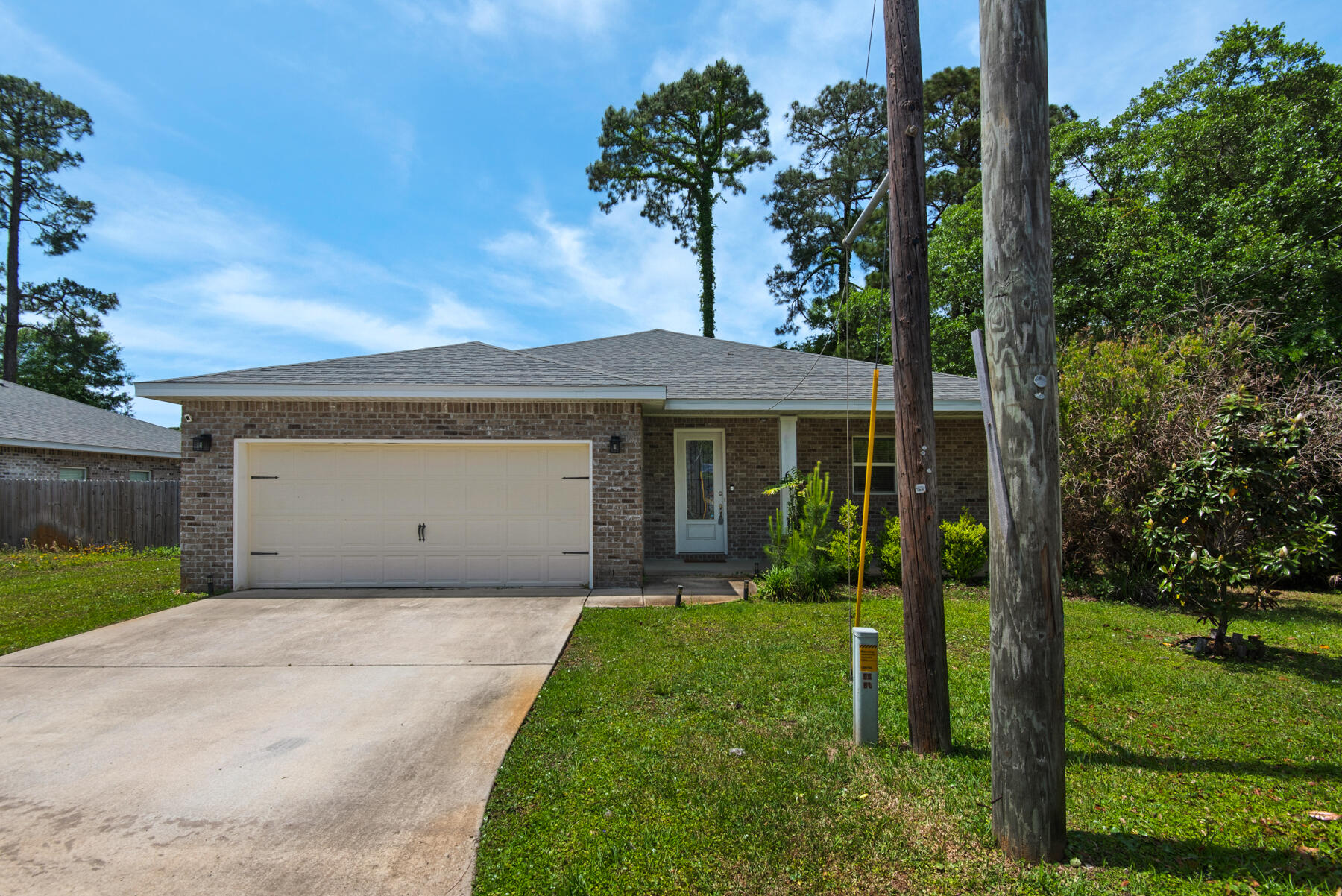 Enjoy modern living in this open-concept home featuring a spacious kitchen with stainless steel appliances and a convenient breakfast bar. The master suite offers double sinks, quartz vanity tops, a tiled walk-in shower, and a relaxing soaking tub. The fully fenced backyard and covered back porch are perfect for entertaining. Ideally located just 9 miles from Navarre Beach and 15 minutes from downtown Fort Walton Beach, with easy access to Hurlburt Field and Eglin AFB. Owner will allow fully grown dogs up to 75 lbs. No cats. Residents are enrolled in the Coastal Realty Services Resident Benefits Package (RBP), which includes renters insurance, HVAC air filter delivery, a resident rewards program, and more!