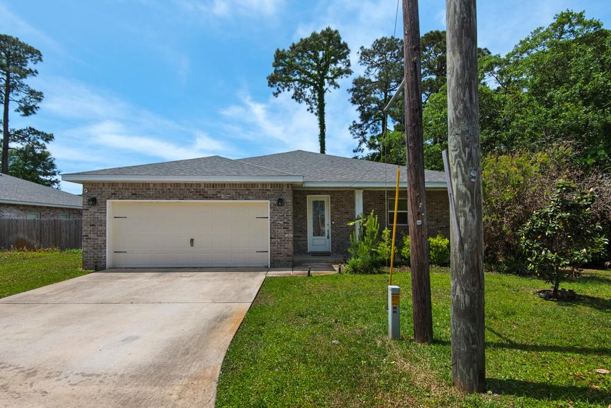 Enjoy modern living in this open-concept home featuring a spacious kitchen with stainless steel appliances and a convenient breakfast bar. The master suite offers double sinks, quartz vanity tops, a tiled walk-in shower, and a relaxing soaking tub. The fully fenced backyard and covered back porch are perfect for entertaining. Ideally located just 9 miles from Navarre Beach and 15 minutes from downtown Fort Walton Beach, with easy access to Hurlburt Field and Eglin AFB. Owner will allow fully grown dogs up to 75 lbs. No cats.  Residents are enrolled in the Coastal Realty Services Resident Benefits Package (RBP), which includes renters insurance, HVAC air filter delivery, a resident rewards program, and more!