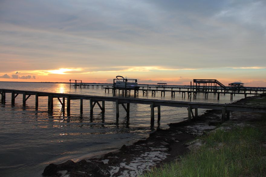 Beautiful water views plus dock and screened in pool. This Tudor style home is dated but well-maintained, has 4 bedrooms and 3.5 baths on an oversized lot. Three of the bedrooms have their own bathroom plus a beautiful view of the water. Whether you choose to swim in the Choctawhatchee Bay or the glistening swimming pool you will have lots of fun in the sun. The home is in good shape but does needs updating throughout entire home. There is plenty of room for boats and cars and jet skis with the 3.5 car garage! Great location and close to Destin, great schools, shopping, restaurants, and the beach!