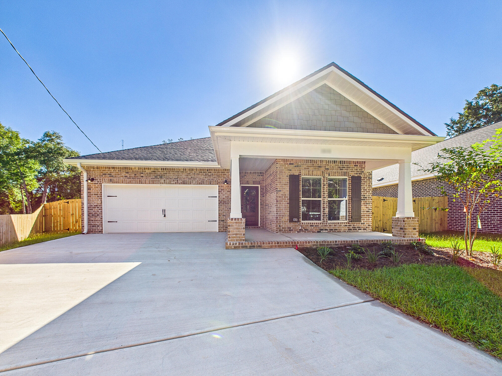This new construction home can be ready September 30th and features 5 bedrooms and 3 full bathrooms, offering an ideal space for creating memories with your loved ones. With a spacious 2,340 sq ft of living space and an 2.5 car garage, this home combines modern comforts and Southern charm seamlessly. The kitchen is well-appointed with granite countertops, tiled backsplash, soft close shaker cabinetry, pendant lighting over the island and a stainless steel appliance finish. LVP flooring graces the entirety of the home, adding both style and durability. This custom home is adorned with crown molding, trey ceilings, and Matte Black hardware, providing a contemporary touch. You'll also enjoy lower electric bills due to the use of natural gas for the heat, cooking range, dryer hookup and tankless hot water heater. Additional Inclusions: Your new home comes complete with a fence for added privacy, blinds for comfort, and a fridge for convenience. Don't miss out on this incredible opportunity to make this house your home. Contact us today to schedule a viewing and take advantage of this fantastic offer before it's gone!