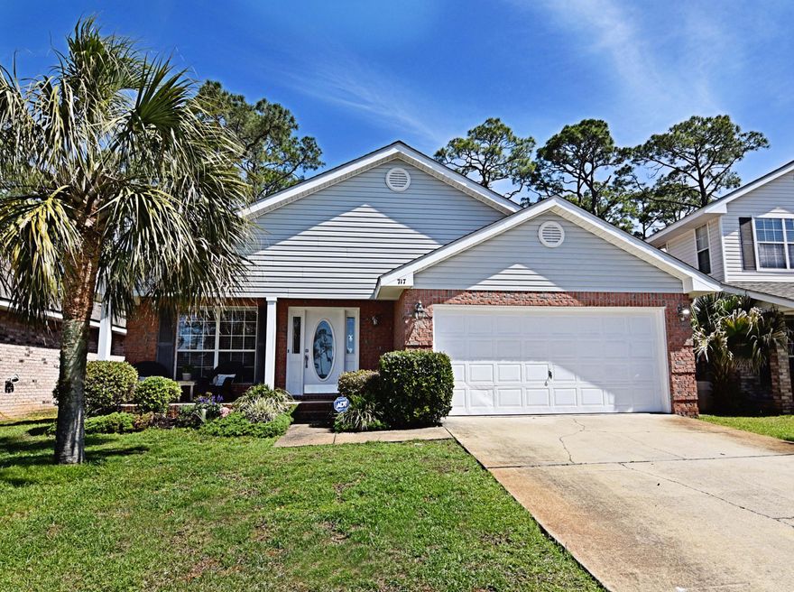 This 3 Bedroom 2 Bathroom home is in the desirable neighborhood of Marsh Harbor in Mary Esther, FL alongside the Santa Rosa Sound, convenient to Navarre Beach and Hurlburt Field. The spacious family room includes vaulted ceilings to make the home feel even larger, with an open living concept that transitions smoothly to the fully upgraded kitchen. Brand-new stainless steel Samsung appliances, granite countertops, a composite granite kitchen sink, and backsplash tile adorn this kitchen complete with a feature wall.The 2003 builder grade tile and vinyl floor replaced with dark hardwood flooring plus premium underlayment in approximately 1100 square feet of the home. Both bathrooms have been completely remodeled with new porcelain sinks and countertops, cabinetry, backsplash tile