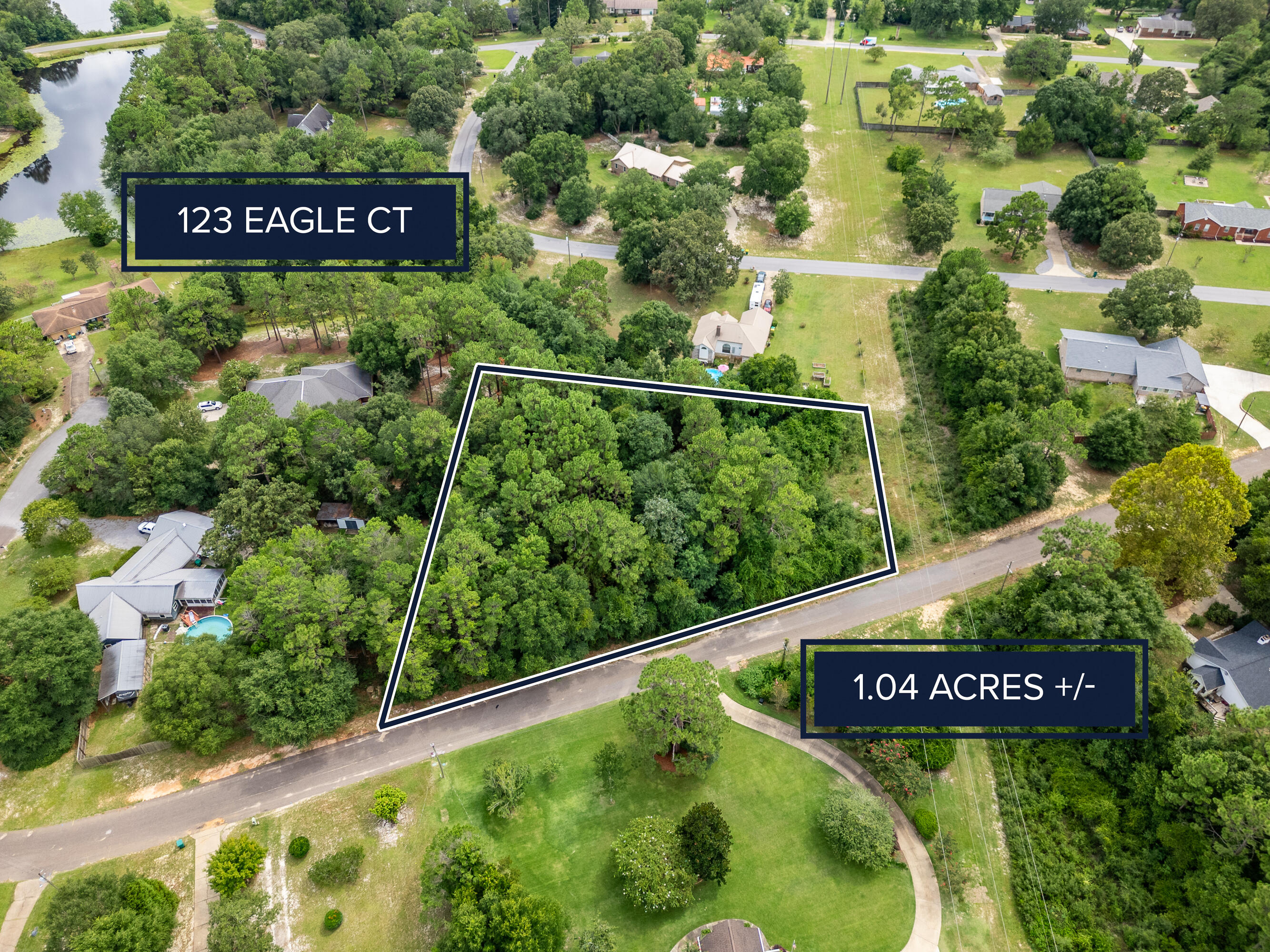 Imagine arriving with your dream home blueprints in hand, greeted by the whisper of wind through the towering trees. This full one-acre lot in Grandview Heights is one of the last untouched treasures in the neighborhood - a peaceful, wooded retreat that's still just moments from top-rated schools, convenient banking, and vibrant shopping. Here, privacy meets convenience, and your vision becomes reality.