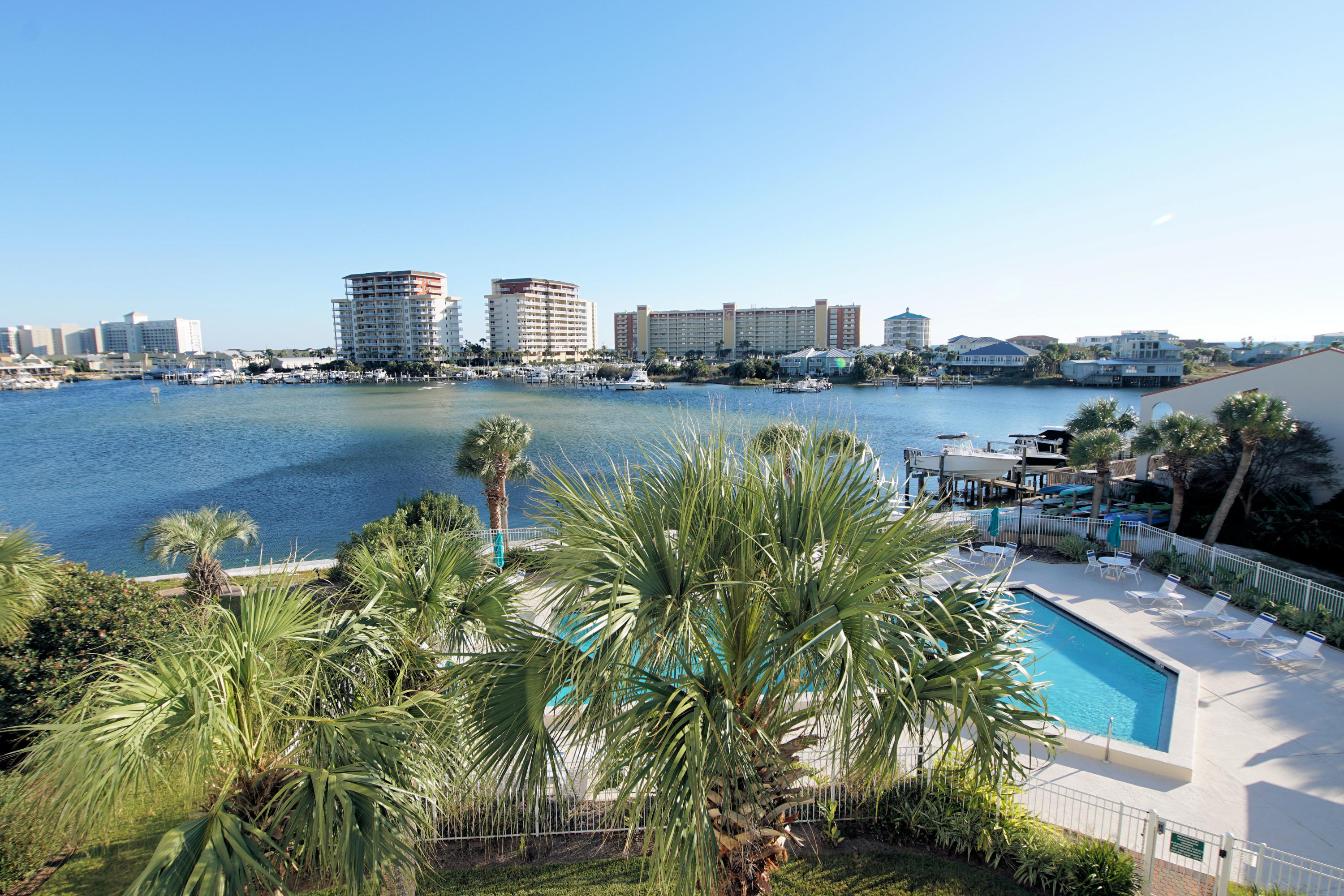 Great 4th floor unit that has been completely updated. New windows, air conditioner, cabinets, granite, floors, recently painted. View of the lagoon, the pool and the harbor-all the way to the bridge. Has been a long term rental for the last 3 years. Partially furnished so could be a short term rental with great income. Dolphin Point is a very long waterfront property directly on the harbor. Have the water taxi pull up and take you to the Harborwalk area for dining or playing. Close to shopping, and all Destin has to offer. The beach is a 3-4 minute walk with a private gated entrance. Holiday Isle has no public parking in this area so the beach is usually lovely and not crowded. There are wonderful seating areas around the property with gas and charcoal grills. Owner is a licensed FL agent