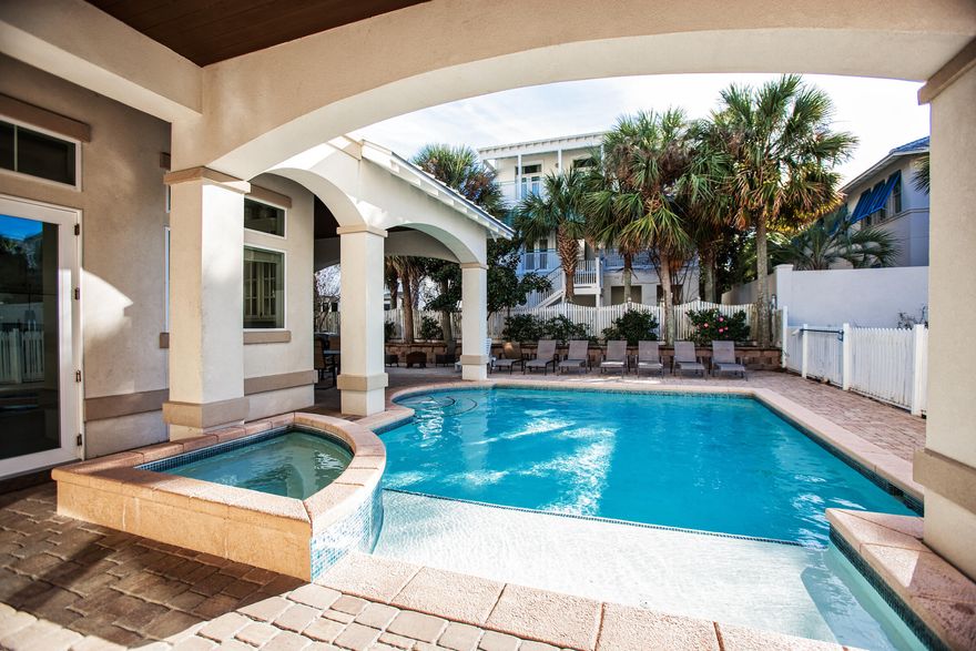 Stunning 3 story Mediterranean style home with private pool only a 2 minute walk to the private beach access! This breathtaking home boasts 7 bedrooms, 7 and a half bathrooms, 3 living areas, and a large contemporary kitchen with stainless steel appliances including dual dishwashers and 2 sets of washer/dryers. There is ample outdoor space with 2 covered balconies, a  covered outdoor kitchen featuring a five-burner grill, two mini-fridges, a sink, an ice maker, flat-screen TV and alfresco dining for six. The fenced-in backyard also features an outdoor shower and private heated pool surrounded by lounge chairs. This stunning house is fully detailed with chic decor and high end finishes. Rental Machine with $234k rental projection.