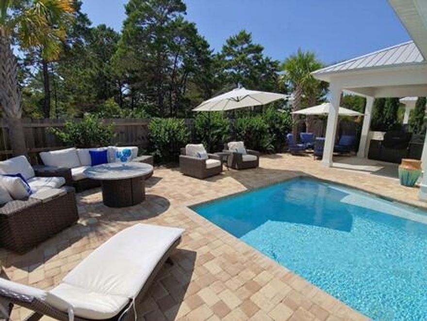 Incredible Beach House, newer built, as well an established & profitable Vacation Rental! It's highly popular as 1 of the only like it on the market currently! Not only is it a Like-NEW, Expertly appointed & maintained beach house, it's in a highly desirable location, walkable to the beach, shops and restaurants! This home has almost $75K bookings currently remaining to transfer!! Guest have given this home over 35 rave 5 star reviews. This makes sense from so many angles! Additional Info: Impact-rated construction! *All listing data is deemed to be correct, but buyer/s responsible to verify all as needed. Exterior Features: Solid built home by a local builder w/ 2 x 6 Exterior Wall Construction; Metal Roof, Concrete Hardie board Siding; Luxury Pool and back yard; Foam Roof/Wall Insulation Extra Wall Insulation for Sound proofing; Plenty of Paver Parking for Vehicles.

Built in Grill on the left side of home; low maintenance, natural landscape; Other Upgrades/ Features: Sliding door window wall opens to the back yard.  Lots of windows for natural light; 2" Window Shutters through-out; 8ft Exterior and Interior doors; Baths/ Showers tiled to the ceiling; Soft-close cabinetry; Upgraded lighting, plumbing & door hardware; Very LOW-COST-TO-OWN home, with low HOA fees! It's close enough to walk to the beach at Ed Walline, but far enough away to have the serenity that you want!  Walk or ride your bike to the restaurants and shops at Gulf Place! This is perfect for the beach life/ outdoor living/ Golf-cart lifestyle you are looking for! It is tastefully furnished and appointed and being sold fully turn-key!  There is a Main 'King' Bedroom on the 1st and 2nd floors; a bunk Room and a 'Queen' room. Excellent floorplan and functional/ tasteful layout! Make it yours!