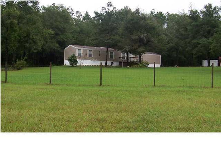 Unique private setting! Just Reduced! Motivated Seller! Get a nice piece of Florida while prices are still low!! This beautiful 20 acre parcel has the privacy yet short drive to beaches, towns, or I-10! Featuring gently rolling land, approximately 2/3 wooded and 1/3 pasture, 2 small creeks, 2002 well-kept home, deep well, 2 acres fenced. Private drive on paved road. Located approximately 7 miles North of Freeport, FL. The 4 lane is almost complete making this area even more accessible to the beaches and making the land even more valuable. Shown by appointment only please!