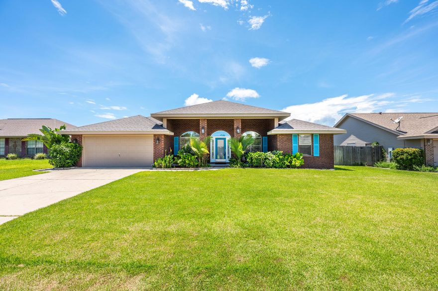 Nestled in the community of Bay Pines just off East Bay Blvd, this 4 bedroom 2 bathroom home offers a formal dining room and sitting room. With a spacious open floor plan, you'll enjoy the beautiful wood-look tile throughout the main living areas and the covered lanai with outdoor fan and fully fenced backyard with a privacy fence. The kitchen comes equipped with a breakfast bar, ample cabinet storage, stainless steel appliances and a pantry. You love the 2 separate dining areas with a sizable breakfast nook suitable for a 6 top table. The primary suite has French doors opening to the lanai and the bathroom features a double vanity with dual closets and a large soaking tub with separate walk-in shower. The guest room also has private access to the lanai and privacy away from the two additi onal bedrooms. This is a true 4 bedroom with a formal sitting and dining room. Other mentionable features are hurricane coverings, gutters, side door garage entry, and RING doorbell. Bay Pines is a no-outlet neighborhood. Located just 11 miles to beautiful Navarre Beach and 20 miles to Hurlburt Field. Check out out full video tour on the MLS and YouTube.