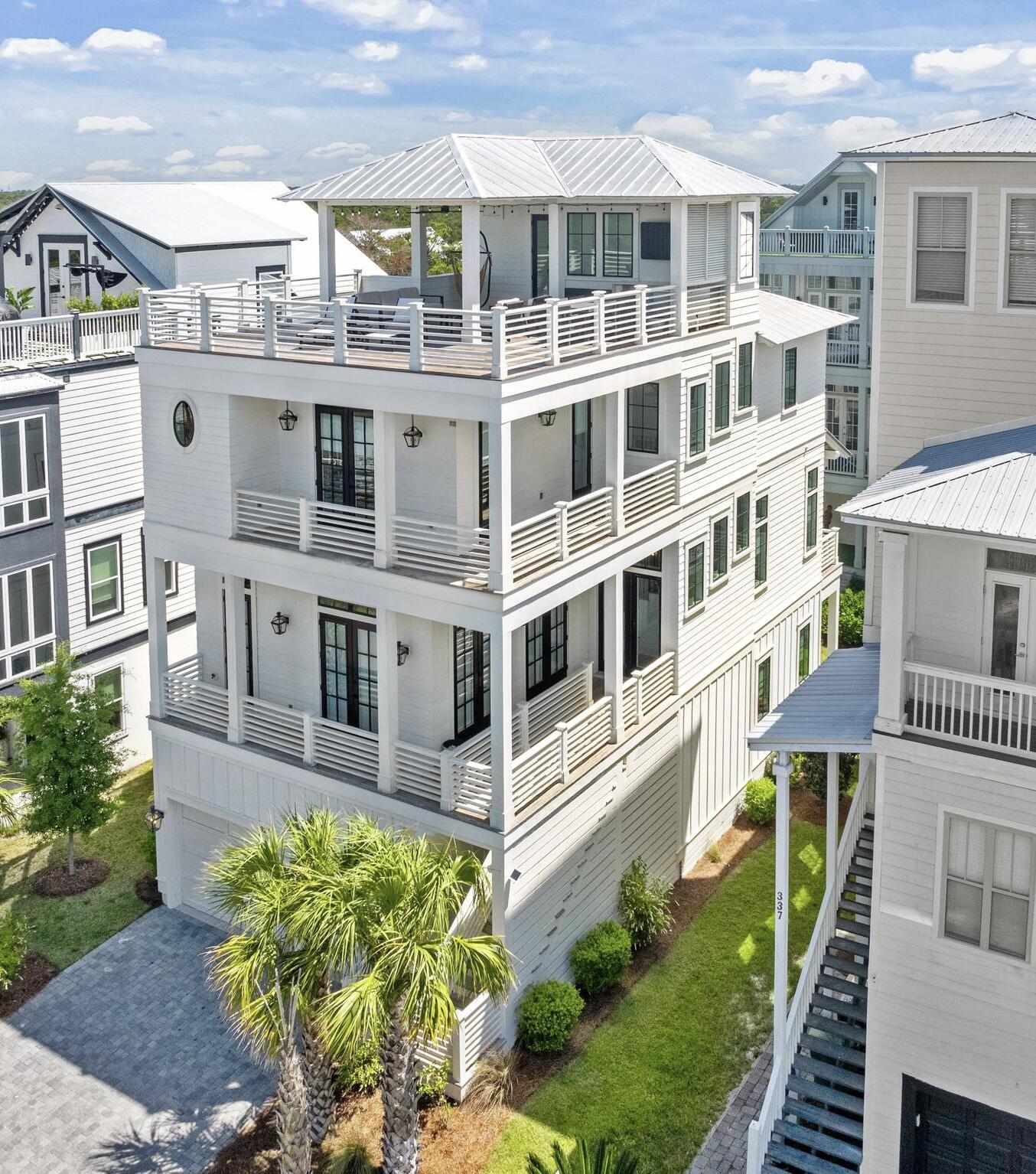 Welcome to 327 Grande Pointe Circle. A showstopping four-story custom coastal retreat offering over 3,300 square feet of professionally designed interiors, panoramic Gulf views, and effortless access to the best of 30A.This turnkey, fully furnished residence features a first floor in-law suite with a separate living space and wet bar, an elevator, multiple indoor and outdoor living areas, and an oversized garage complete with an e-car outlet.The crown jewel of the home is its rooftop deck, delivering breathtaking vistas of the Gulf, a wet bar and features both covered and uncovered areas perfect for alfresco dining, Sunbathing and stargazingThe chef's kitchen flows seamlessly into a bright, open living and dining space with refined finishes and curated coastal lighting and decor. Grande Pointe's resort-style pool, dock, and clubhouse overlooking Lake Powell is the perfect location to soak up the Florida sunshine 
And this home is located just steps from the sand and minutes from Rosemary Beach, this home is ideal as a luxury rental investment, a full-time residence, or a vacation haven.