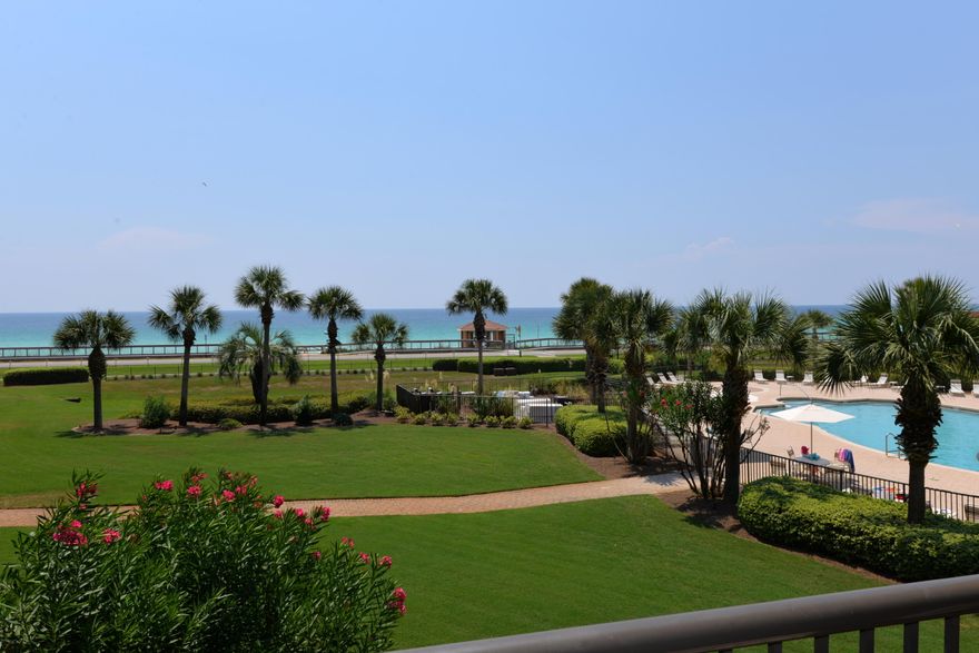 IT'S THE VIEW THAT COUNTS!! AND THIS ONE HAS IT!! Indulge in the charm of this well decorated two bedroom, two bath condo  one of the largest two bedroom units along Scenic 98. The open floor plan offers all that are present an opportunity to enjoy each other's company whether in the delightful kitchen cooking or on the balcony enjoying the view. Relaxing on the spacious balcony accessible from the living area & the master bedroom places you even closer to the gulf allowing you to enjoy the coastal breeze. The kitchen features hard surface counter tops & a nice pantry. Other amenities include tile in the main areas, nine foot ceilings, separate laundry room with new washer & dryer, custom draperies, crown molding, luxury master bath, storage cage, & an assigned covered parking