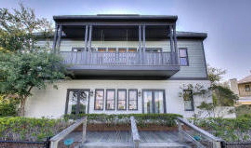 Old world charm meets modern sensibility in this exquisite renovation. 5 BR (plus loft) / 5 BA home and carriage house. Situated fronting the tennis courts on one of the main boardwalks that leads totheo of Rosemary Beach's four pools, Eastern Green and beach, location is ideal. An oversized lot provides the setting for a beautiful private brick courtyard and lawn with ample space for both the main and carriage houses to enjoy, not often found in Rosemary Beach. A wonderful built in seating area with fire pit is located at one end of lawn. Entering the the main house from the courtyard you find a sunroom style kitchen and dining room, enhanced by charming ten foot heart pine doors that let outdoor beauty shine in. A brick wall, concrete floors, granite countertops, 11 foot ceilings,