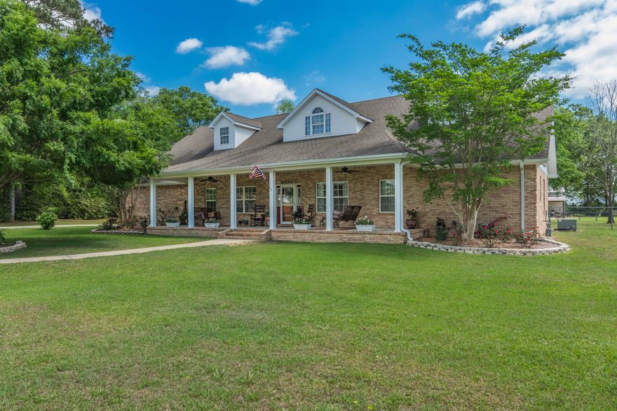 COUNTRY LIVING AT IT'S FINEST! Quality custom-built all brick home and huge barn/workshop situated on nearly 5 acres in Baker...this 4 bd/3.5 ba home has large front and rear porches for relaxing, swinging and having your morning cup of coffee. Inside you will find a grand foyer entrance, 12' ceilings and crown molding throughout the main living areas and an open floor plan. The spacious great room boasts a gas fireplace and kitchen is a chef's dream. Beautiful hickory stained cabinets, granite countertops, upgraded appliances (including under cabinet ice machine) and center island w/ prep sink. Light and bright Florida room w/ travertine stone and plumbed for a wet bar/sink. Great master suite - large bedroom - and the bathroom features a jetted garden tub and amazing shower - SEE SUPP