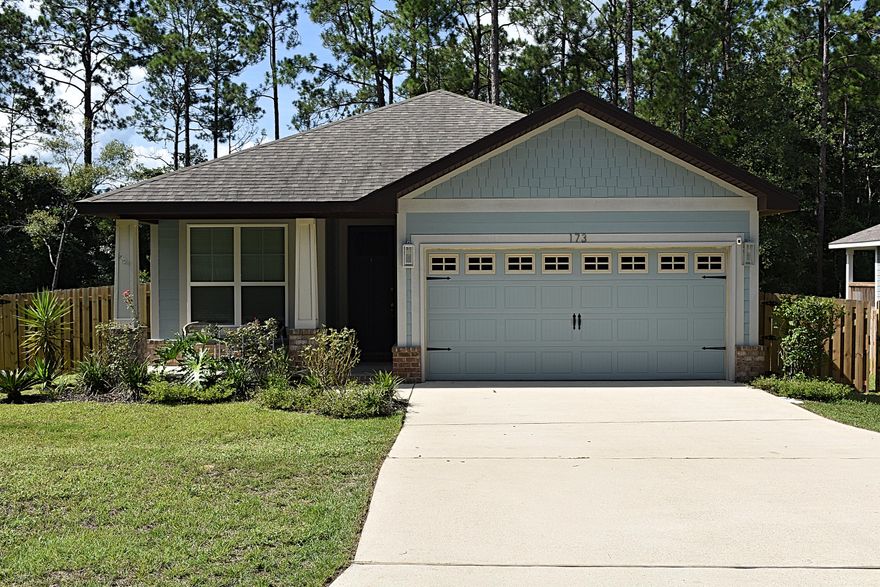 Beautifully upgraded Craftsman in The Canopies. This single-story three bedroom, two bath home features 1,425 sf of well laid out living space. Freshly painted light and bright, luxury vinyl plank flooring throughout the living areas, new carpet in the bedrooms. The Kitchen and bathroom counter tops have been upgraded with Quartz and bright white cabinets. Upgraded master tile shower with stone bottom and seamless shower doors. The outdoor spaces extends your living to those beautiful Florida Days with a screeened in porch and freshly painted Grilling Deck. The Fenced yard offers lush views off the rear Deck and privacy for the kids or pets.Designer Light fixtures in several signature spaces makes this home show like a Model home. Canopies offers a community pool.