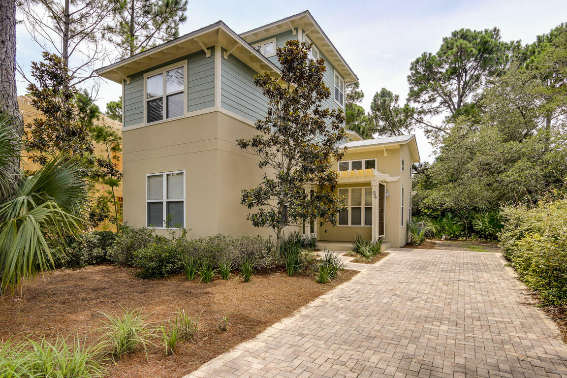 This precious Florida Cottage is nestled in a quiet, peaceful cypress grove in the unique community of Cassine Village. This community has all the amenities of Nature Walk & Watercolor Crossing but is just steps from the beach & first class restaurants & shopping. The association fee is very inexpensive - & includes 2 pools, 2 tennis courts, a central park with a private lake with fish & gazebo, & its own cypress nature area & fitness trails, grills & picnic area & a basketball hoop. It also adjoins state forest biking & hiking trails. It's this unique mix of quiet nature & the sunny gulf with snow white beaches, settings that make Cassine Village a wonderful family home or vacation destination! The home is professionally decorated & furnished with an artist's hand & eye. All the window