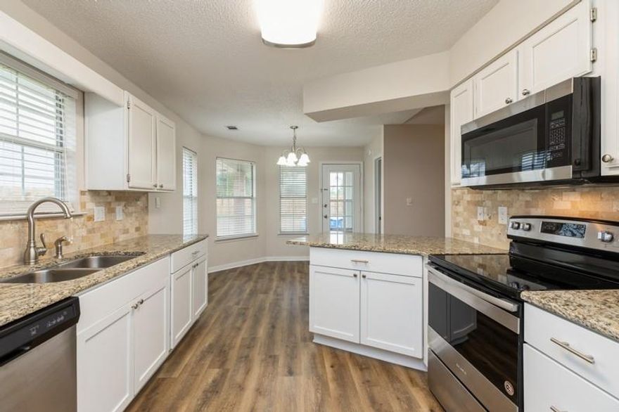 Distinctive architectural upgrades make this home truly appealing!  Sunny bay windows brighten the dining area & guest bedroom!  A sunny arch window, also in guest bedroom, bathes the room in natural light!  Lovely renovations in this ranch home include new luxury vinyl flooring, new carpet, new cabinetry, spacious master bedroom, large walk-in closet with organizers, granite countertops, ceiling fans throughout!  And there's more!  Stainless-steel appliances, wood-burning fireplace, brick exterior, vaulted ceiling, natural stone tile backsplash.  Backyard shed & small above-ground pool!  Privacy-fenced backyard!  This property is conveniently located between Hurlburt Field & Eglin AFB!  Minutes from Emerald Coast beaches!