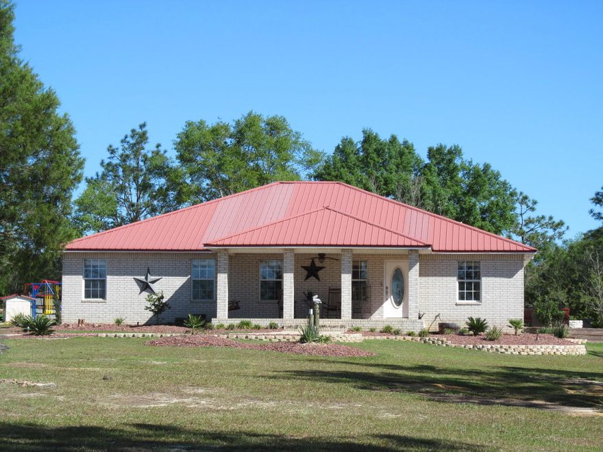''Custom Country Living!'' This property offers you the best of both worlds. A modern, contemporary, custom built home surrounded by 26 acres. Your private winding driveway leads you up to the house that is built on one of the highest points in North Walton County (What a view!). Built in 2006, the home includes ceramic tile floors, cathedral ceilings, oversized master bedroom with deluxe master bath that includes double vanities, detached shower and jacuzzi style tub. The custom kitchen includes a 21 foot kitchen bar, high end appliances like Electrolux, Bosch and LG. A new high efficient CH&A was installed in 2015. Average electric bill is $150.00 per mo. The 26 acres had the pines cut. Seller has root raked almost all the 26 acres. Shown by appt. 24 hours notice please.