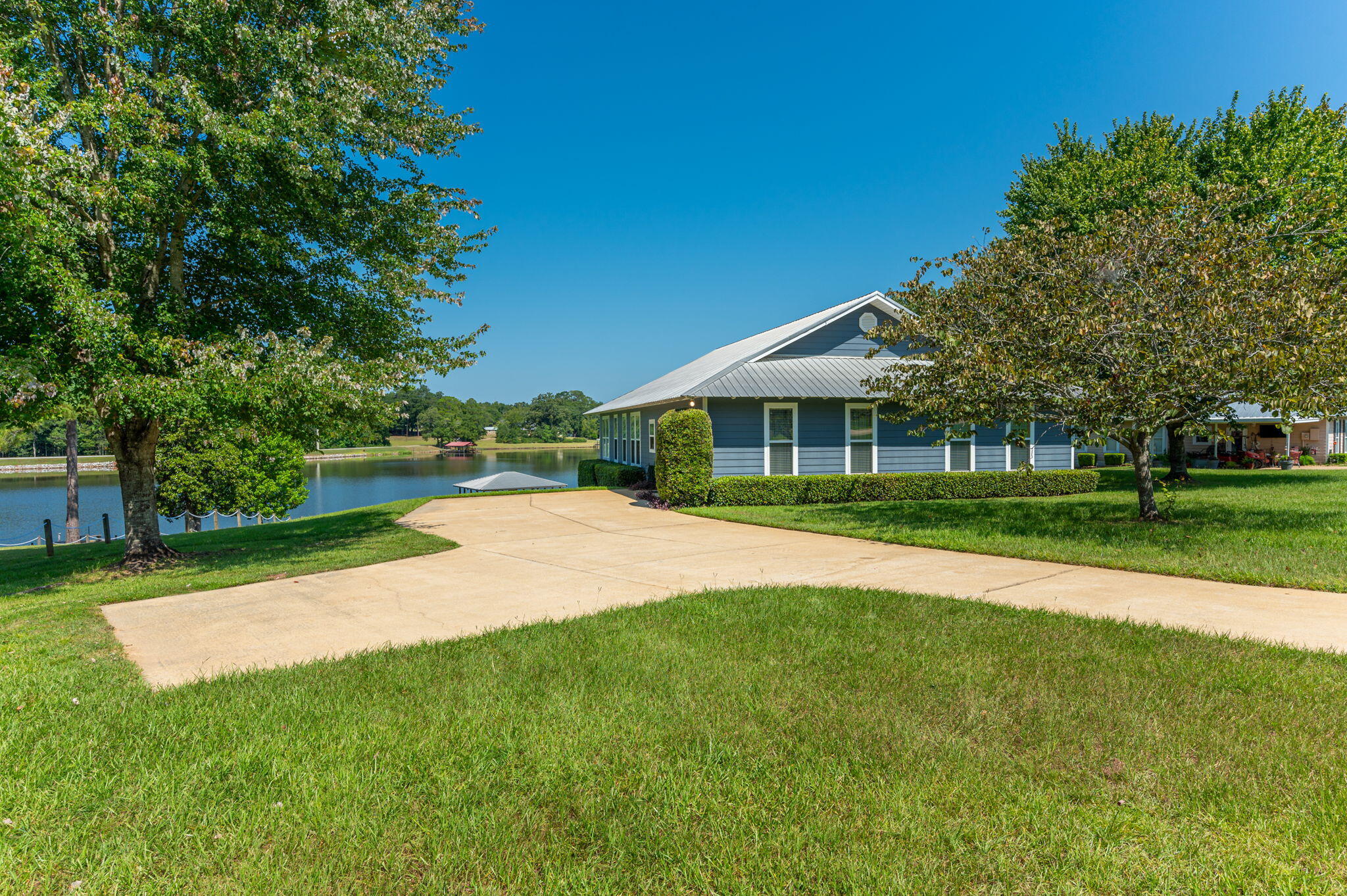 Sitting on 1.1 waterfront acre overlooking Gantt Lake this home is a must see to appreciate the detail and care put into home! Large open floor plan includes all the MUST to include custom kitchen with plenty of cabinets, breakfast bar, top of the line appliances and tons of counterspace. The kitchen connects to a great living area and makes entertaining a dream! Home has a great sunroom overlooking backyard and lake and exterior door that welcomes you to boat house and boat launch. The home includes an amazing yard with a private access to Gantt Lake with private boat launch. This is a must see to appreciate! Home has option to buy completely furnished - Great family or retirement home or weekend getaway from the hustle and bustle!