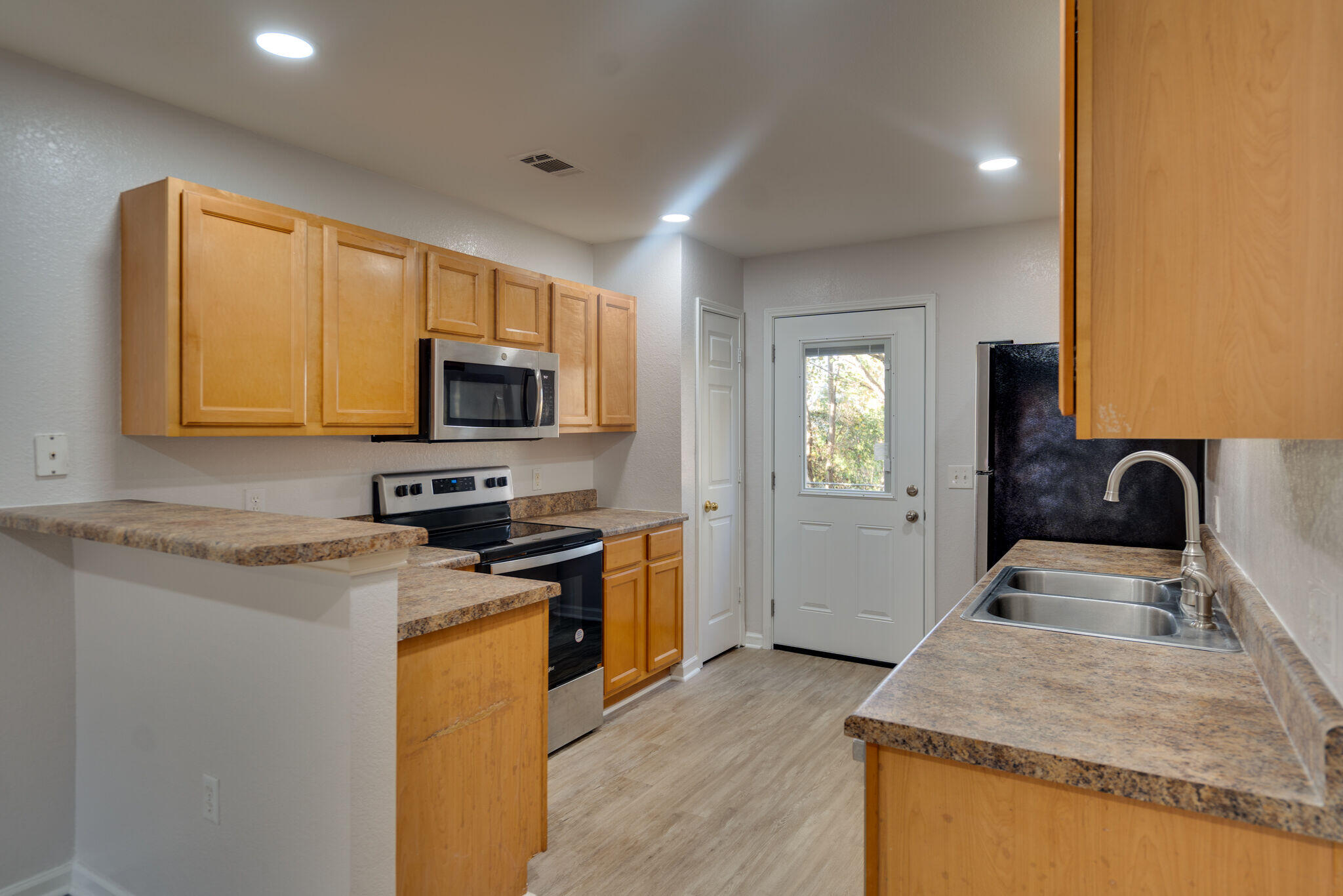 Seller is now offering $10,000 towards buyers closing costs with an acceptable offer. Newly renovated townhome overlooking the lake, located in the heart of one of Destin's highly sought-after neighborhoods. Convenient to shopping, dining, entertainment, and public access to the Beautiful Emerald Coast beaches! Watch the Emerald Coast's gorgeous sunsets on your back patio overlooking the lake!As you enter, you will appreciate how spacious and airy this two-story townhouse greets you with high ceilings, an open concept style and brand new LVP flooring. The kitchen features laminate countertops, stainless steel appliances with ample space to cook, a breakfast bar, and wood cabinetry with abundant space for your dining table. The primary owner's spacious bedroom is on the first floor with a view of the water, as well as the owner's bath. The additional two, sizeable, bedrooms and bathroom are located on the second floor with freshly, cleaned carpets. Large coat/storage closet under the stairs.
A new water heater was installed in 2016. New can lights just installed in the kitchen and dining create a fresh bright glow for cooking and dining. The garage has an automatic garage door opener for parking your vehicle inside with ease as well as storing your fishing gear or beach toys for your enjoyment. This will go quickly so call your favorite agent today! Buyers should verify measurements and all other details deemed important.