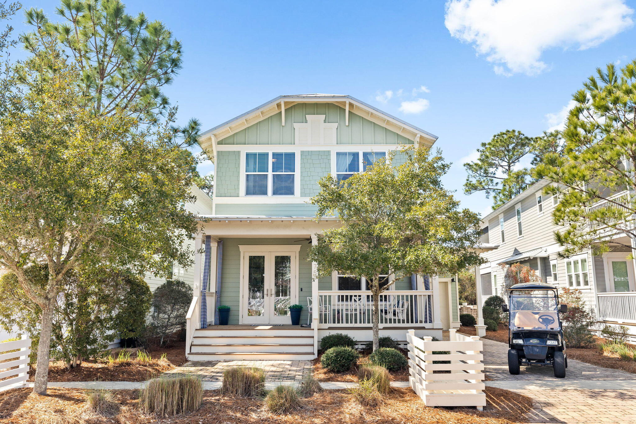 Experience the ultimate 30A lifestyle in this immaculate, turn-key home, sold fully furnished and accessorized, complete with a golf cart for effortless coastal living. Nestled in the highly sought-after NatureWalk at Seagrove, this stunning Sea Glass floor plan exudes charm with its nautical-inspired design and prime location just minutes from the sugar-white sands of the Emerald Coast.A cozy front porch welcomes you with picturesque views of Sunset Pond, while French doors open into the bright and airy dual living spaces. Thoughtfully designed with hardwood floors throughout, a natural gas fireplace, coffered ceilings, and shiplap walls, this home blends luxury with coastal comfort. The chef's kitchen boasts stainless steel appliances, a pantry, granite countertops, and a spacious island with a breakfast barperfect for entertaining. Designed to accommodate guests with ease, this home features two guest suites, a master suite, and a custom bunk room for three. A separate sitting area adjacent to the kitchen leads to a spacious screened back porch overlooking the wooded preserve, creating the perfect private retreat. Additional highlights include a one-car garage, climate-controlled owner's storage, and ample space for a golf cart, bikes, and beach gear. Whether you're seeking a lucrative short- or long-term rental or your own slice of paradise, this home delivers incredible investment potential in one of 30A's most desirable communities!
The amenity-rich NatureWalk community is situated in a premier location offering accessibility to area restaurants and the Watercolor Publix right next door and amenities such as a trail to the beach that's less than a mile and The Gathering Place that is centrally located and features a playground, heated lap pool, zero entry pool, hot tub, fire pit, grills, TV, bar area for a variety of gatherings and plenty of seating. Other community amenities include fitness stations, multi-purpose courts, pickleball, and a variety of trails throughout. Whether you're searching for an investment property with $84K in projected rental revenue, a second home, or a primary residence, come home to NatureWalk.
