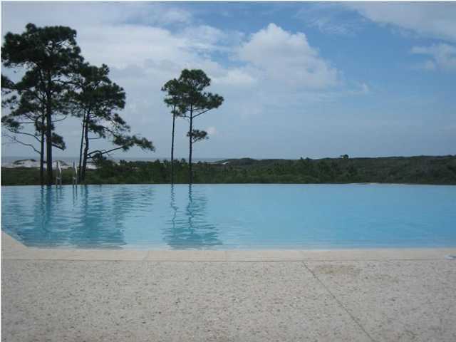 Build your own home in ''paradise''. Lot 83 offers forever privacy and is located across from the 200+ year old Cypress Pond. Situated along the west end of Scenic Hwy 30-A the 44 acre community is bordered by the Topsail Hill State Preserve. A vast array of amenities for both full time residents or rental guests. Turtle Shuttle Service to the beach runs from Memorial Day through Labor Day! It's most known for the infinity edge pool overlooking the Topsail Preserve and the Gulf of Mexico. Other amenities include tennis courts, exercise center, outdoor fireplace, dining room. Native landscaping and ponds surround the pedestrian friendly community. Floor Plans that ''fit'' are Long Key, Tobago, Melbourn, Waterway & Twilight.