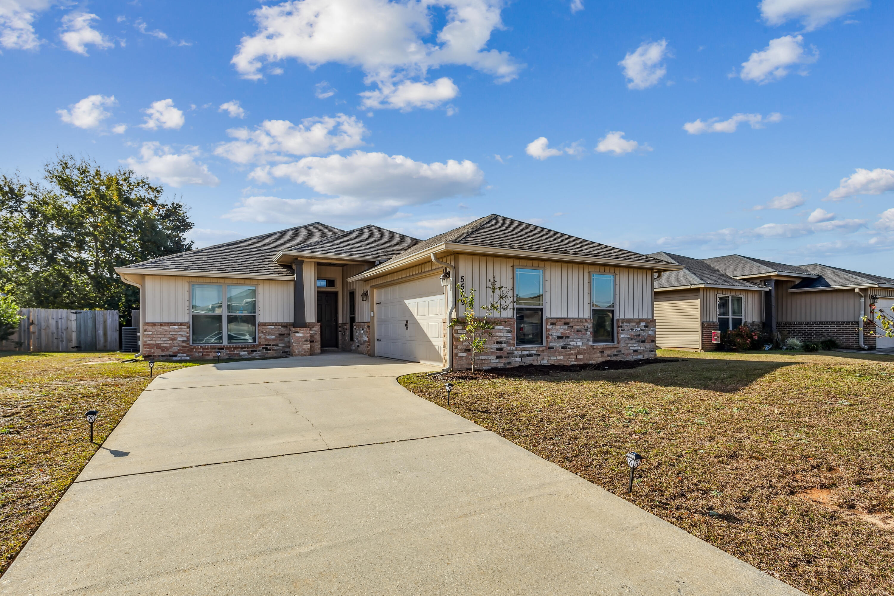 Welcome to this charming, well maintained, 3 bedroom, 2 bathroom, 2 car garage home with a bonus room, located right on the border of Milton and Pace in The Woodlands community. Perfect for anyone who commutes anywhere in Milton, Pace, Pensacola, or surrounding areas - just 10 minutes to I-10. Featuring an open concept living area for a seamless flow between the living, dining, and kitchen areas. A culinary enthusiast's delight - with a large kitchen island with granite countertops, breakfast bar, black and stainless steel appliances, and plenty of cabinets and counter space. Split floor plan with the primary bedroom with ensuite located at the back of the home, just off the living area with double door entry. Versatile bonus room located at the front of the house just before the kitchen and laundry room - perfect for an office or playroom. The 2 additional bedrooms, and full bath are located to the left of the living area down their own hallway. Don't forget to make your way outside to check out the fully fenced in backyard!