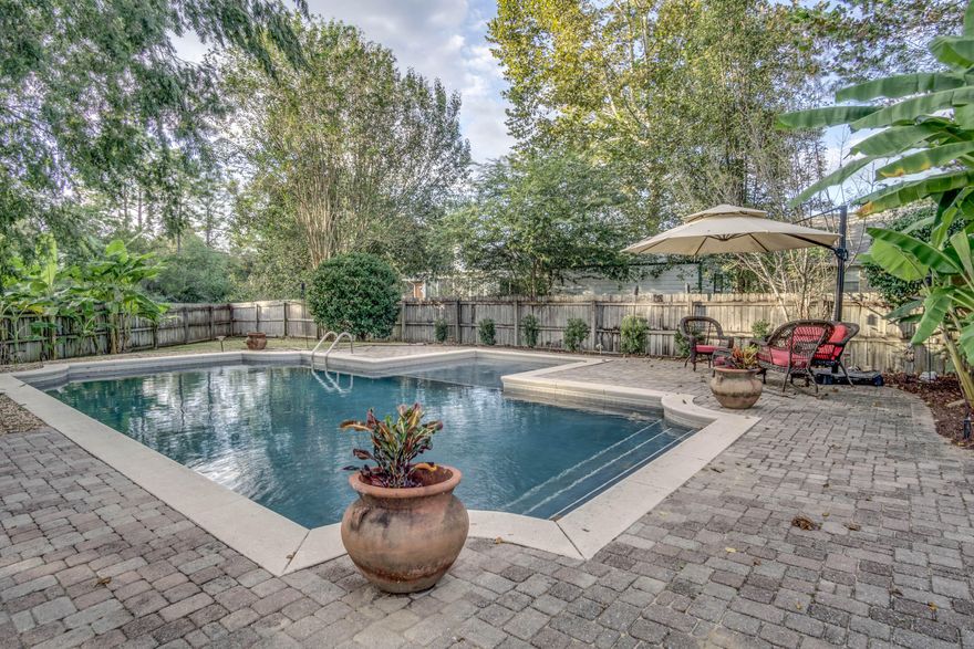 GORGEOUS Gunite saltwater HEATED Pool, South of I-10, New Roof being installed, spacious open floor plan 4 bed 2 bath home with ALL tile flooring, kitchen with island and stainless steel appliances, large master, split bedroom plan, irrigation system, side entry garage, all brick construction! The backyard is fully fenced, has storage shed and paver patio.The kids outdoor playset can stay! Don't miss it because it will sell fast at this incredible value! Super quick and convenient commute to all area military bases, schools, shopping, and the beaches of the emerald coast. Call to schedule your private showing today!