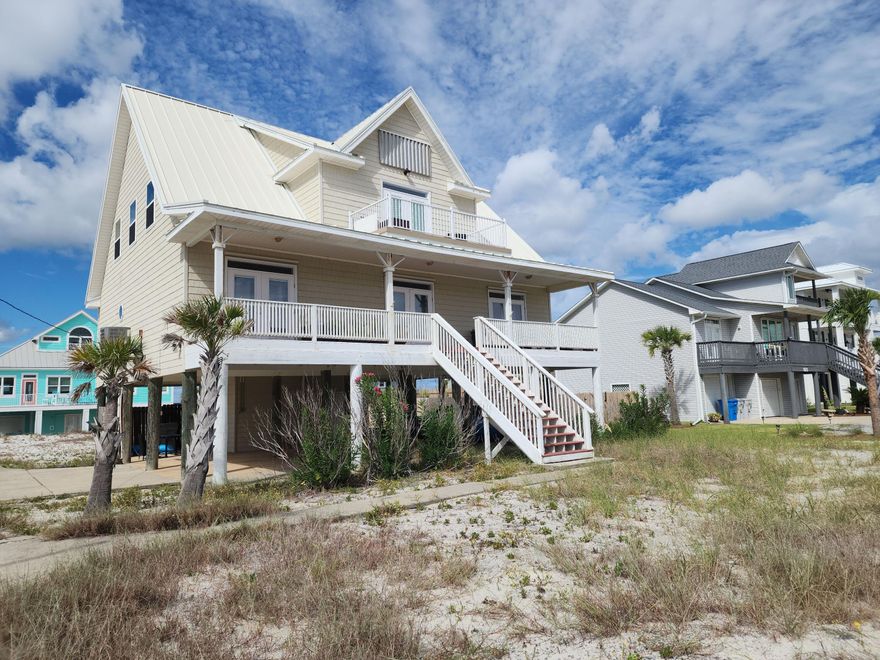 'Beautiful custom built house on Navarre Beach. SPECTACULAR views of Gulf of Mexico and Santa Rosa Sound from each room. Over 600 Sq Ft of porches and decks. 3 bedroom, with optional 4th bedroom or study, 2 bathrooms. Home features granite kitchen counters, custom kitchen cabinets, stainless steel appliances, farm sink and a large pantry. 21' vaulted ceiling in Living Room with open floor plan with kitchen and dining room. Large Master bedroom with large walk-in closet, master bath with antique clawfoot tub and vanity. Antique vanity in downstair bath as well. Italian tile resembling hardwood floors in main living area, with hardwood floors throughout rest of house. Lots of beadboard and wainscoting. Large laundry room with separate entry. Minutes to beach. Pets allowed with pet deposit.'