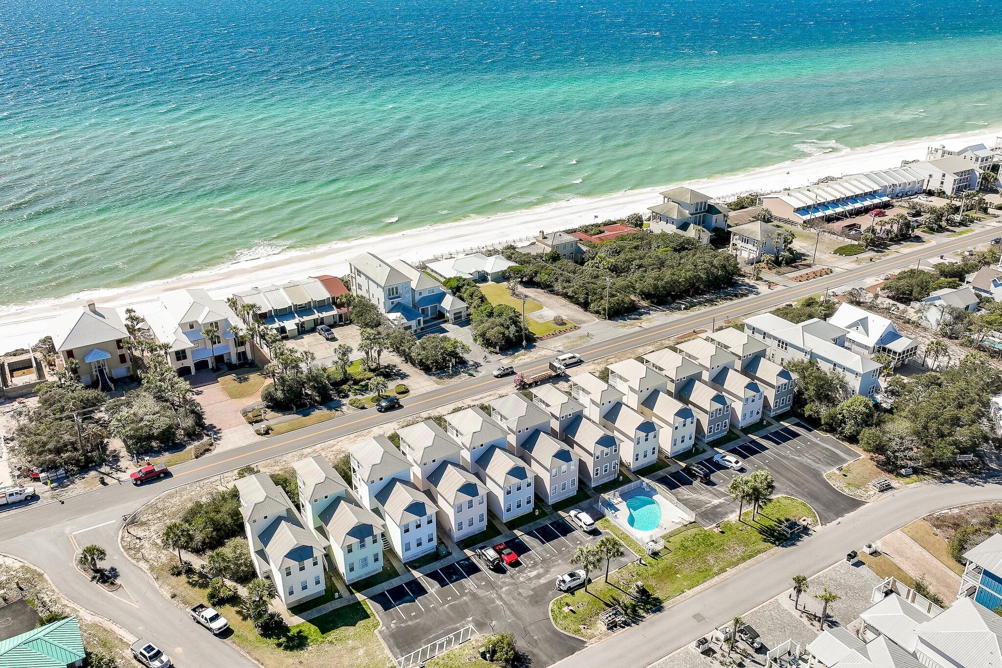 Discover the perfect coastal retreat at 69 Seabreeze Trail, ideally situated right across from 2 public beach accesses on Scenic Hwy 30-A! This stunning 4-bedroom, 4 bath home boasts incredible Gulf views from multiple levels allowing you to enjoy the soothing sounds of the waves.With balconies on each level, this home is designed for relaxation and entertainment. The open floor plan includes two generous bedrooms on the first floor both with ensuite bathrooms.The second floor includes an additional bedroom, a bright and airy kitchen, and a welcoming living area that showcases stunning views. While the third floor offers a versatile space with a full bathroom and private balcony--perfect for enjoying morning coffee or evening sunsets.This property is a rental machine, with easy access to all the attractions along 30A. Enjoy the community pool and dedicated parking spots, making this an unbeatable value! Don't miss your chance to own this beautiful home just 75 steps from the beach!