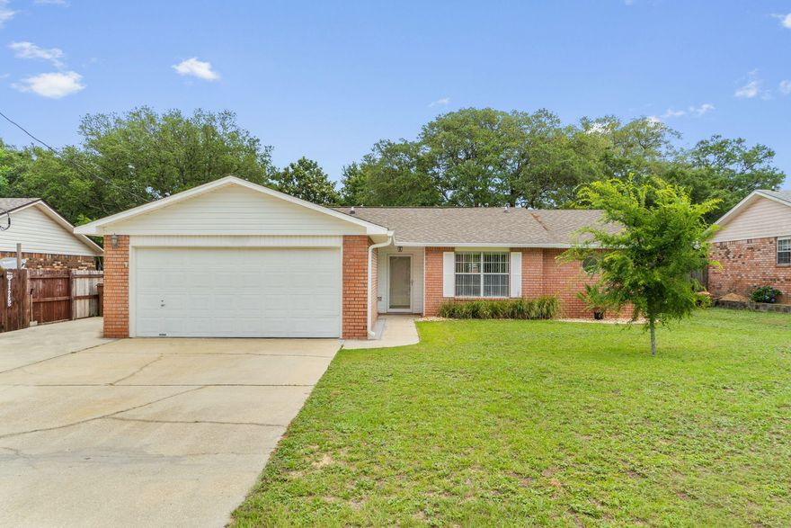 You will want to check out this great brick home located in Navarre in only minutes to shopping and the beautiful beaches! Their is fresh paint throughout and new flooring throughout as well.  The home features 3 bedrooms, 2 bathrooms, a separate dining room and breakfast nook.  The master suite offers double vanities and two walk in closets. The home also features a few bonus features such as a spacious Florida Room, large covered rear patio and privacy fenced back yard.  The owner has just replaced the water heater as well.  This home has a lot to offer and at only $310,000, it won't last long. Contact your agent today to take a private tour.