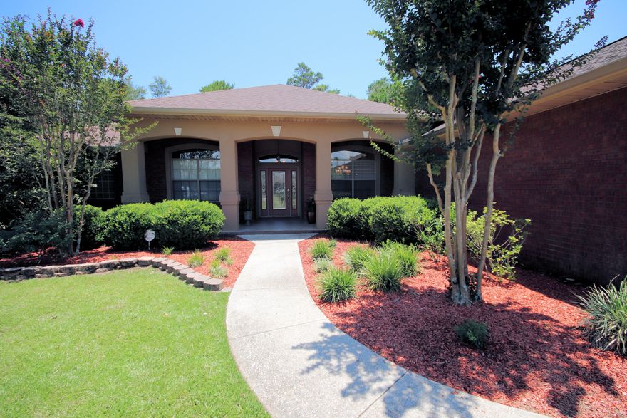 Exquisitely designed home in Holley by the Sea, a well-established and extremely popular community nestled in the heart of Navarre FL between the pristine waters of the Gulf of Mexico and the beautiful backwaters of East Bay. Sitting on just under half an acre (plenty of room for a pool!), this spacious home features a private backyard paradise that is a must see. Hickory Wood cabinets! Complete with a screened in sun-room, it provides perfect ambiance to enjoy Florida's tropical evenings. The multi-million dollar rec center offers amenities galore as well as a world class golf course. Built by Integrity Homes INC