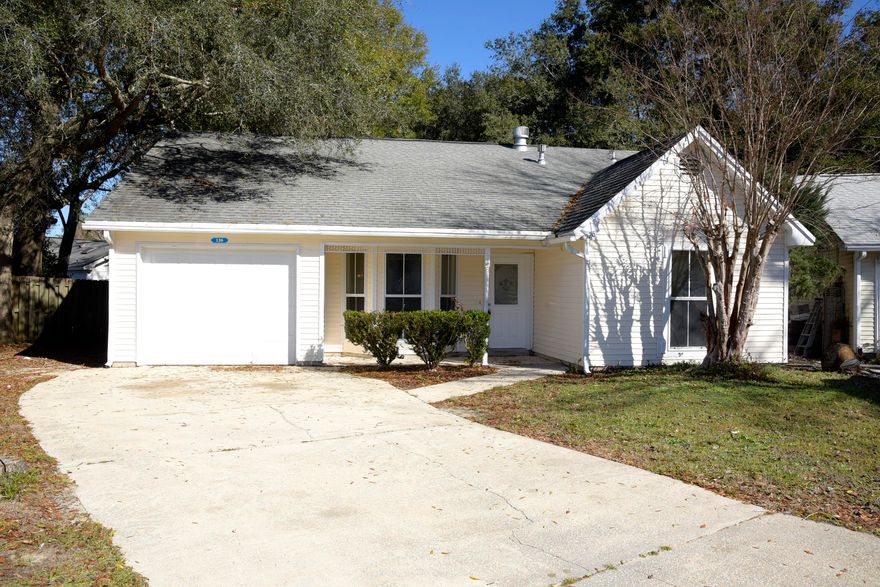 Have you been searching for an affordable home in a great location?  You'll love the open floor plan featuring a wood burning fireplace in the great room and access to both the eat-in kitchen and the screened porch overlooking the large fully fenced backyard. New carpet and paint were added in December 2020 along with a new ceiling fan in the screened porch. Porch is in the process of being re-screened - will be completed prior to closing. Enjoy all the amenities that Bluewater Bay has to offer along with close proximity to Bluewater Elementary, shopping and businesses.  Come take a look today!