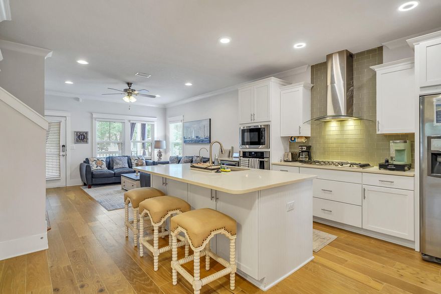 Pride of ownership shines in this beautiful 4bedroom/3.5 bath home featuring hardwood flooring throughout; quartz countertops in the kitchen and the bathrooms; a master bedroom on the main level with a second master bedroom upstairs. The chefs kitchen features a gas cooktop, glass tile backsplash, and stainless-steel appl. The open floor plan on the main level is great for entertaining, while the upstairs living area is perfect for movie night. Loads of storage space in this home, 3 of the 4 bedrooms have walk-in closets, additional storage closets on both levels. Enjoy game day on the outdoor TV on the large, covered porch and enjoy grilling in the fenced private backyard. This home is a perfect  primary residence or solid vacation rental investment!