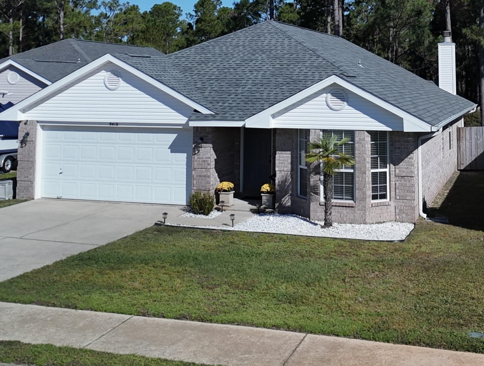 Great all brick home at Whisperwoods estates, with a sweet price.  This home is very clean and is painted with neutral colors and has attractive laminate flooring.The home is just 8 miles west from Hurlburt Field's main gate and 6 miles from the beautiful Navarre beaches. The street is a cul-de-sac and has sidewalks. Its features a 2017 roof, 2017 energy water heater, Oct 2024 new heatpump air conditioning system, new dishwasher, updated paint, light fixtures, and fans.  Comes with microwave and security camaras (w/ an app).  The yard is very spacious, fenced and has a lawn pump, and small storage shed.  The garage has attic access stairs for extra storage.  Don't miss your opportunity to own this beauty, can be a great investment property or your sweet home.