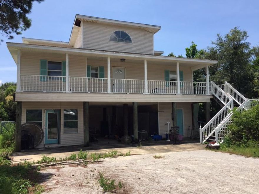 Location, Location, Location! Beach Cottage needs TLC. Home is situated just two blocks north of 30A in Gulfview Heights between Gulf Place & Blue Mountain Beach. Beach access is just a bike ride away. This property is now under auction terms. All offers should be submitted through www.Auction.com. This property is subject to a 5% buyer's premium pursuant to the Auction Terms & Conditions (minimums may apply).
