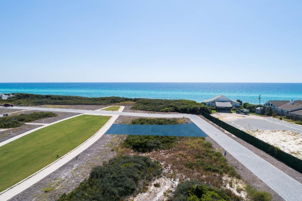 Located on elliptical Bela Gray Park just steps from the gulf of Mexico by way of the Bela Gray Beach Access.  Accommodates up to 3 story home with full roof top terrace.