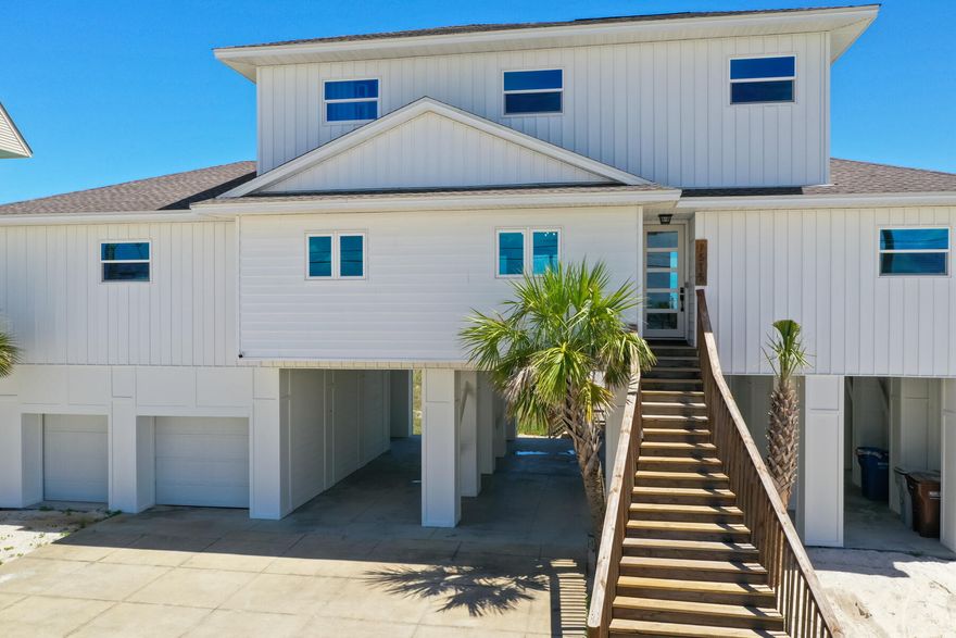 The beach house of your dreams has arrived! Resting about a private sandy bluff along nearly 100ft pristine Gulf frontage, rests this beautiful 4 bedroom, 4 bath, + bunk room, residence lovingly reimagined from top to bottom! The sellers of this home spared no expense in creating a totally immersive experience bringing the best of Florida Gulf front living in, while maximizing comfort and intelligent design creating the best beachfront vacation experience. Navarre Beach has something special unlike other beach towns you may have visited, and this home takes the cake! Every room in the house has incredible views of our dancing emerald green waters and crystal white sands each with their own private bathroom and private sliding door access to a sprawling 1108sf of Gulf front balcony space!