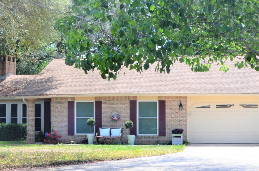 Charming home on almost half an acre in the fabulous City of Niceville, Baywood Estates just off of the beautiful waters of Rocky Bayou. This three bedroom two bathroom home has a great screened in addition with a jacuzzi for relaxing evenings in the back yard. New Rheem 3 ton air conditioner, new French Slider door and impact resistant windows are just a few of the updates. The driveway is roomy and can hold your boat, motor home or lots of automobiles. There are two sheds and a play-set for the kids that will stay. The special touches throughout this home like the new fireplace cover and fans show pride of ownership and make this a must see.